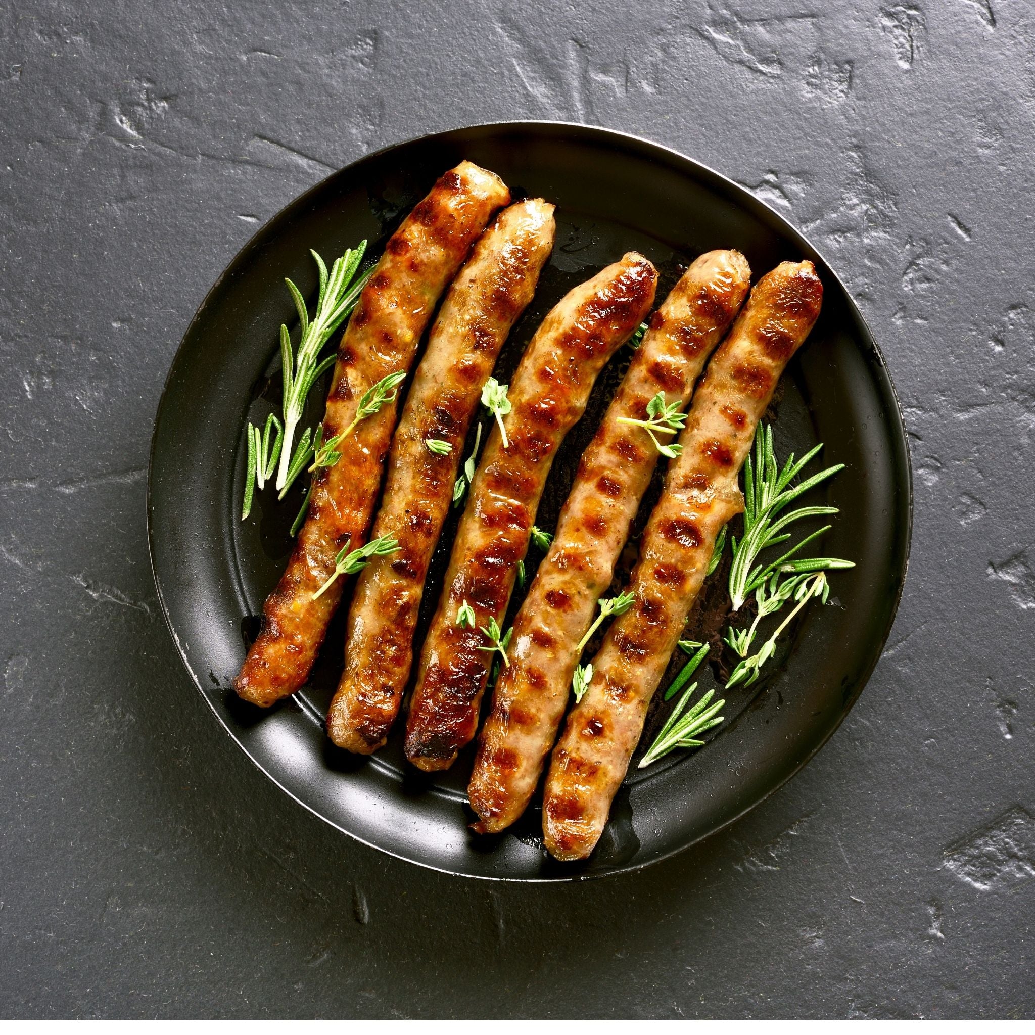 bbq-beef-sausages-thin-500g-pasture-fed-locally-sourced-pasture-fed-with-rosemary-garnish.jpg