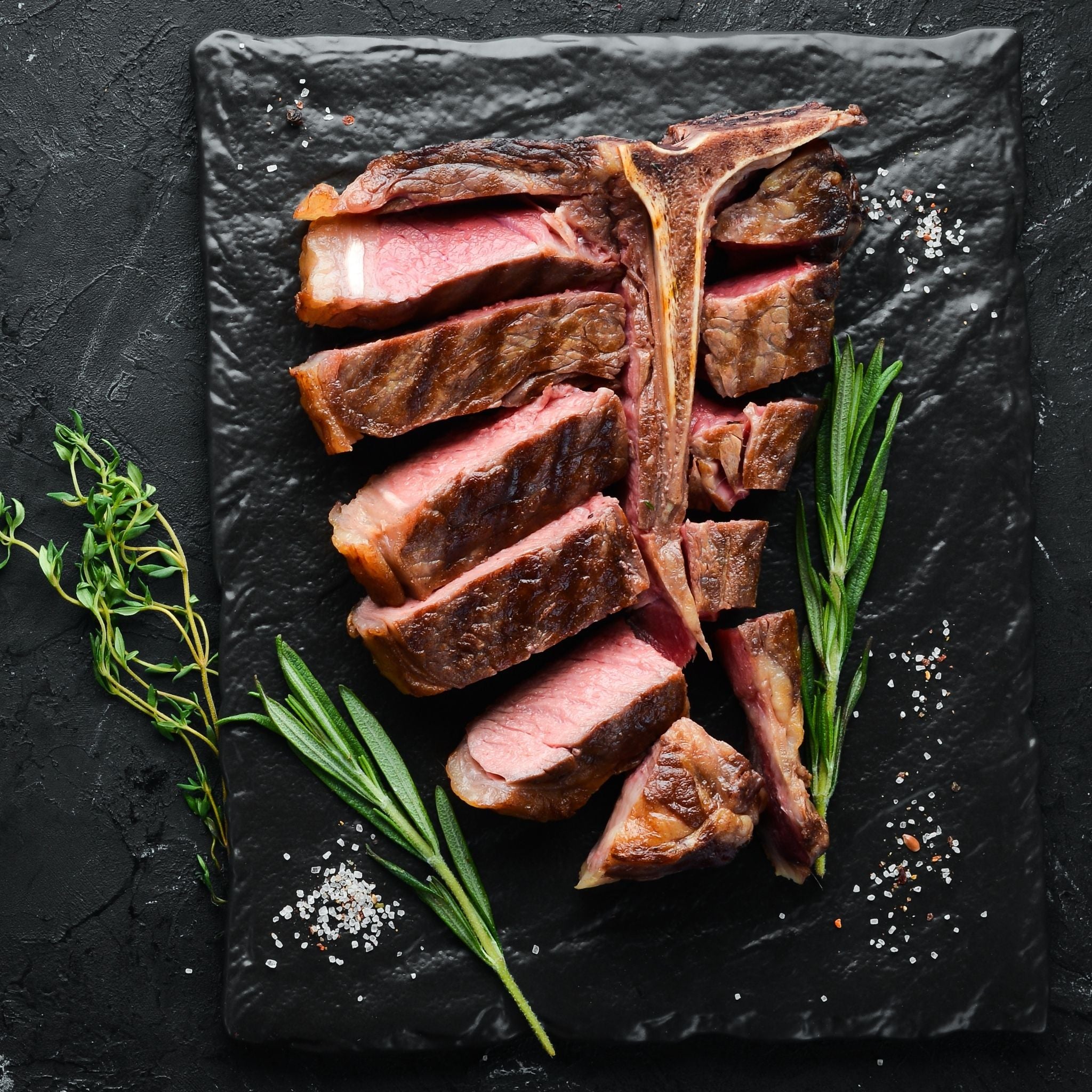 beef-t-bone-steak-500g-pasture-fed-locally-sourced-pasture-fed-cooked-sliced-medium-rare.jpg